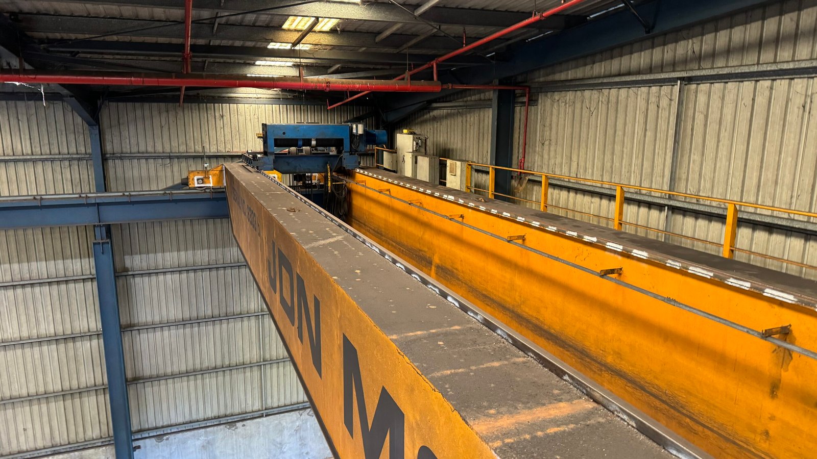 Qualified technicians performing non-destructive testing on a crane as part of 10-yearly compliance inspection