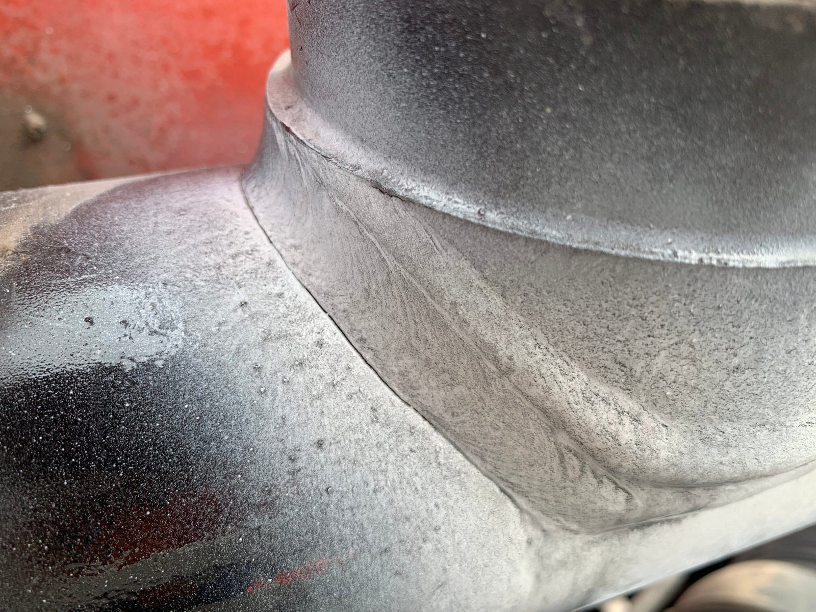 Close-up of a surface-breaking crack on a Palfinger crane hydraulic cylinder revealed with MPI